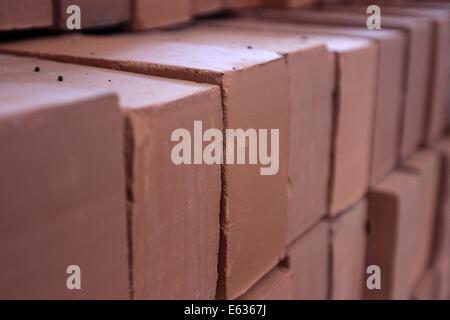 Dhaka 13 August 2014. Pile of red cavity bricks. Stock Photo