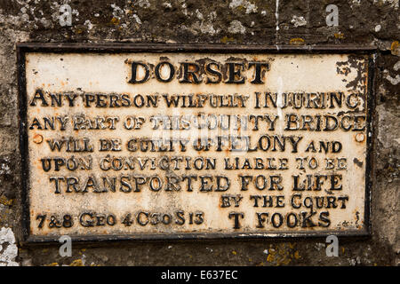 UK England, Dorset, Sturminster Newton, ‘transported for life’ warning sign on town bridge Stock Photo