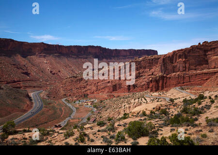 US route 191 and zigzag road entering Arches National Park, near Moab, Utah, USA Stock Photo