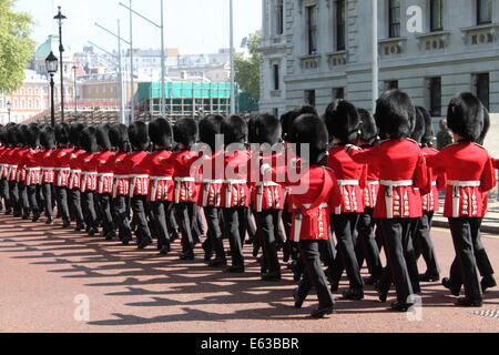 LONDON - MAY 21: The Royal Guards march toward Buckingham Palace for the guard change on May 21, 2010 in London, UK Stock Photo