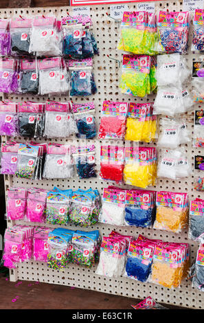 Bags of loom bands for sale England UK United Kingdom GB Great Britain Stock Photo