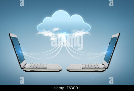 two laptop computers with world map hologram Stock Photo