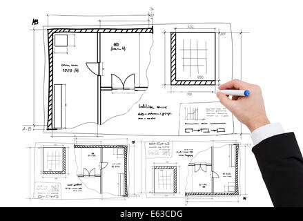 closeup of businessman hand drawing blueprint Stock Photo