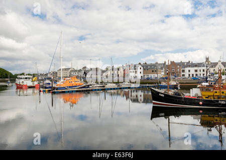 Moored boats reflected in calm water in the inner harbour. Stornoway, Isle of Lewis, Outer Hebrides, Western Isles, Scotland, UK Stock Photo