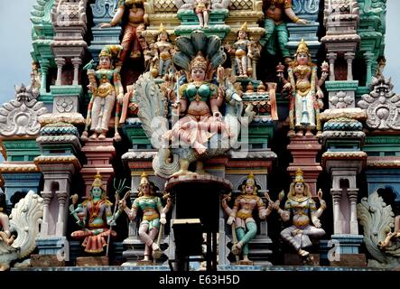 GEORGETOWN, MALAYSIA: Detail of carved figures on the gopuram sikhara entrance tower of the Sri Ramar Hindu Temple Stock Photo