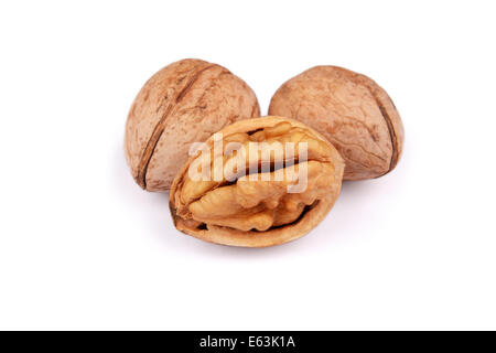 Cracked and not cracked Walnut group isolated on white background Stock Photo