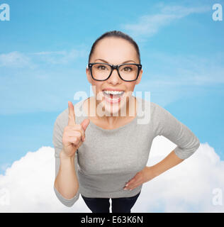 asian woman in eyeglasses with finger up Stock Photo