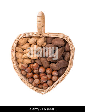 Variety of nuts with almonds, hazelnuts, and Brazil nuts in heart shape basket, isolated on white. Stock Photo