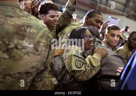 A soldier hugs President Barack Obama following his remarks at Bagram Airfield, Afghanistan, Sunday, May 25, 2014. Stock Photo