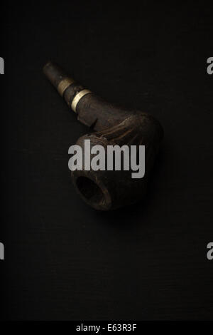 A smokers old wooden pipe. Stock Photo