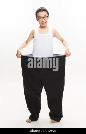 Young Asian Male with oversized pants Stock Photo