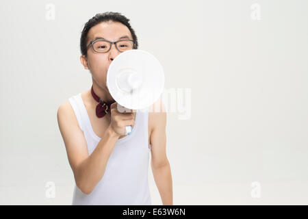 Funky man with loud speaker Stock Photo