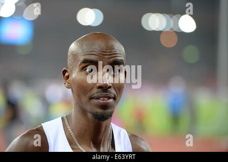 Zurich, Switzerland. 13th Aug, 2014. Winner Mohamed 'Mo' Farah from Great Britain reacts after winning the men's 10'000m final race at the European Athletics Championships 2014 at the Letzigrund stadium in Zurich, Switzerland, 13 August 2014. Photo: Bernd Thissen/dpa/Alamy Live News Stock Photo