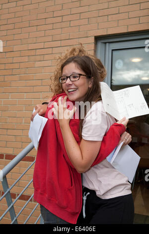 Bromley Kent, UK. 14th Aug, 2014. Students from Bromley High School hug and congratulate each other on their A Level results. Credit:  Keith Larby/Alamy Live News Stock Photo