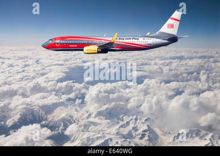 TUIfly Boeing 737-8K5 WL with inscription 'Rail & Fly', with the train to the airport, in flight over mountains, Turkey Stock Photo