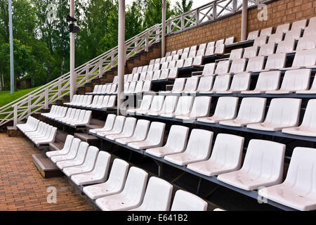 Vacant rows of showground plastic seating. Stock Photo