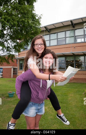 Bromley Kent, UK. 14th Aug, 2014. Students Alex Chrysosthnou and Olwen Mair from Bromley High School celebrate  their A Level results. Credit:  Keith Larby/Alamy Live News Stock Photo