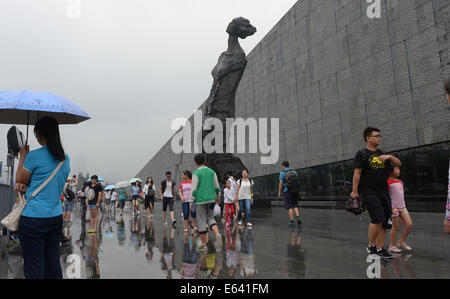 Nanjing. 14th Aug, 2014. People visit the Memorial Hall of the Victims in Nanjing Massacre by Japanese Invaders in Nanjing, capital of east China's Jiangsu Province, Aug. 14, 2014, on the eve of the 69th anniversary of Japan's unconditional surrender at the end of World War II. Credit:  Zhao Peng/Xinhua/Alamy Live News Stock Photo