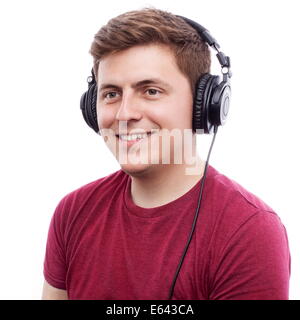 Young happy man listening something on headphones Stock Photo