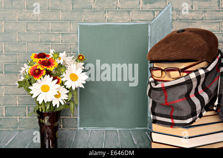 The teacher and flowers before the open door represented on a chalkboard Stock Photo