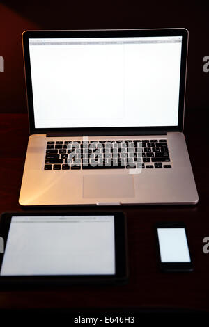 Laptop with tablet computer and smartphone on the table Stock Photo