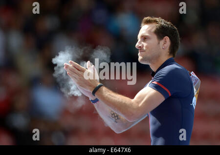 Zurich, Switzerland. 14th Aug, 2014. Renaud Lavillenie of France reacts in Pole Vault Men's Qualification at the European Athletics Championships 2014 at the Letzigrund stadium in Zurich, Switzerland, 14 August 2014. PHOTO: RAINER JENSEN/dpa/Alamy Live News Stock Photo