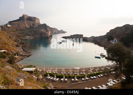 St Pauls Harbour, beach and Acropolis, Lindos Rhodes Greece Stock Photo