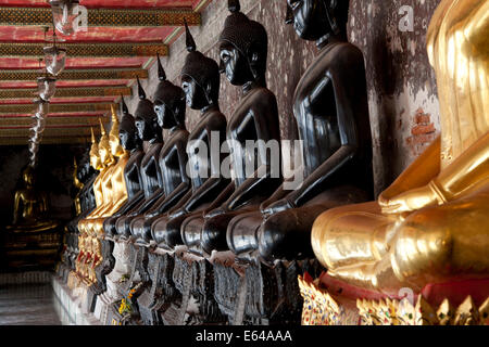 Gallery of Buddhas at Wat Suthat or Wat Suthat Thepwararam, Bangkok, Thailand Stock Photo