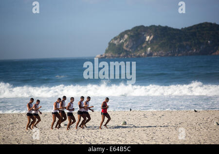 Rio de Janeiro, Brazil. 6th Aug, 2014. Lifeguards are practicing on the beach of Barra in Rio de Janeiro, Brazil, 6 August 2014. The 2016 summer olympics are going to be carried out in Rio de Janeiro. Photo: Michael Kappeler/dpa/Alamy Live News Stock Photo
