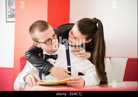 A man and woman couple dressed in 1950's style American clothing fashion retro Stock Photo