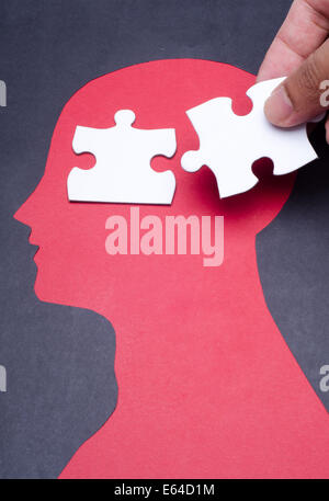 Jigsaw puzzle pieces on the human head Stock Photo