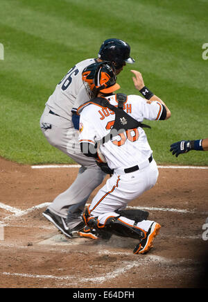 Get On Base. 11th Aug, 2014. New York Yankees designated hitter Carlos Beltran (36) steals home in the second inning against the Baltimore Orioles at Oriole Park at Camden Yards in Baltimore, MD on Monday, August 11, 2014. Beltran earlier walked to get on base. Credit: Ron Sachs/CNP (RESTRICTION: NO New York or New Jersey Newspapers or newspapers within a 75 mile radius of New York City) NO WIRE SERVICE/dpa/Alamy Live News Stock Photo