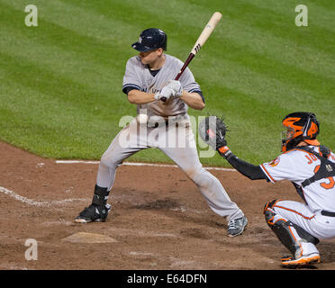 End The At Bat. 11th Aug, 2014. New York Yankees third baseman Chase Headley (12) watches a pitch go by as he bats in the eighth inning against the Baltimore Orioles at Oriole Park at Camden Yards in Baltimore, MD on Monday, August 11, 2014. Headley later drew a walk to end the at bat. The Orioles won the game 11 - 3. Credit: Ron Sachs/CNP (RESTRICTION: NO New York or New Jersey Newspapers or newspapers within a 75 mile radius of New York City) NO WIRE SERVICE/dpa/Alamy Live News Stock Photo