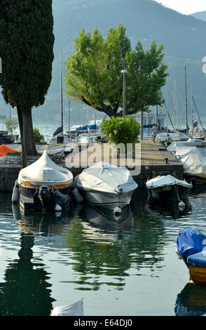 Small boats moored in the harbour at Portese on Lake Garda, Italy Stock Photo