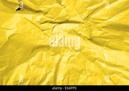 Crumpled deep yellow paper, may be used as background Stock Photo