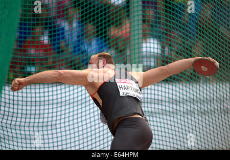 Zurich, Switzerland. 13th Aug, 2014. Robert Harting of Germany competes in the men's Discus Qualifying at the European Athletics Championships 2014 at the Letzigrund stadium in Zurich, Switzerland. Credit:  Action Plus Sports/Alamy Live News Stock Photo