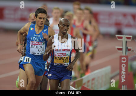 Zurich, Switzerland. 13th Aug, 2014. Winner Mohamed 'Mo' Farah (R) from Great Britain competes in the men's 10'000m final race at the European Athletics Championships 2014 at the Letzigrund stadium in Zurich, Switzerland, 13 August 2014. Credit:  Action Plus Sports/Alamy Live News Stock Photo