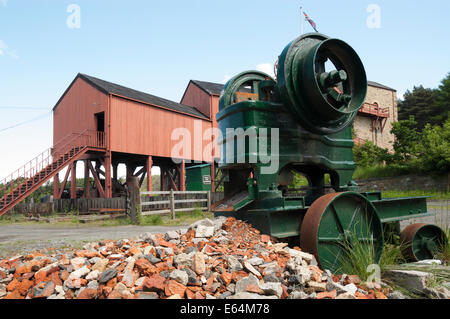 Old mine building at Beamish Museum England.  Bricks and machinery in foreground. Stock Photo