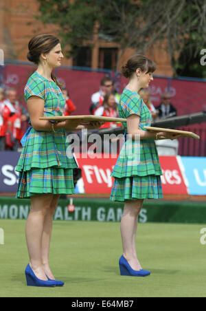 Ladies wearing traditional Scottish tartan ready with the medals for the Womens Pairs at the Kelvingrove Lawn Bowls Centre, 2014 Stock Photo