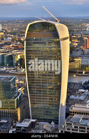 General view of buildings of the city skyline and the Walkie Talkie building at 20 Fenchurch Street at dusk in London, England Stock Photo