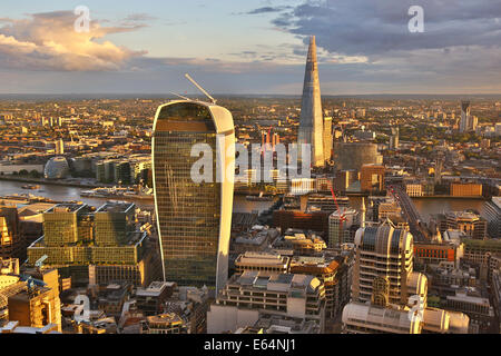 General view of buildings of the city skyline, the Walkie Talkie building at 20 Fenchurch Street and the Shard at dusk in London Stock Photo