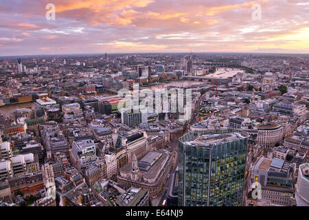 General view of buildings of the city skyline at dusk in London, England Stock Photo