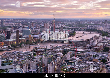 General view of buildings of the city skyline at dusk in London, England