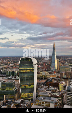 General view of buildings of the city skyline, the Walkie Talkie building at 20 Fenchurch Street and the Shard at dusk in London Stock Photo