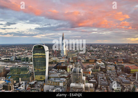General view of buildings of the city skyline at dusk in London, England Stock Photo