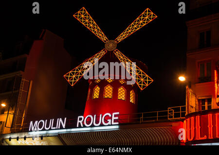 The Moulin Rouge by night in Paris, France Stock Photo