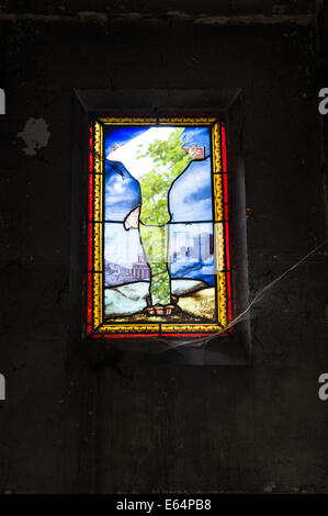 Broken stained glass window of the tomb in Pere Lachaise Cemetery Paris, France Stock Photo