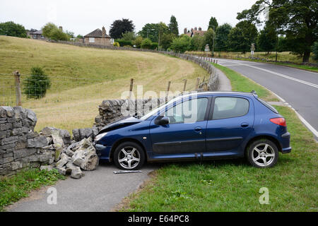Car crash into wall, Derbyshire, England. Stock Photo