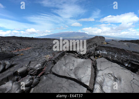 Mauna Kea, Hawaii, from the slopes of Mauna Loa with lava in foreground Stock Photo