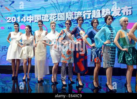 Guangzhou, China's Guangdong Province. 15th Aug, 2014. Models display creations at China 'Liuhua' international fashion show in Guangzhou, capital of south China's Guangdong Province, Aug. 15, 2014. Credit:  Liu Dawei/Xinhua/Alamy Live News Stock Photo